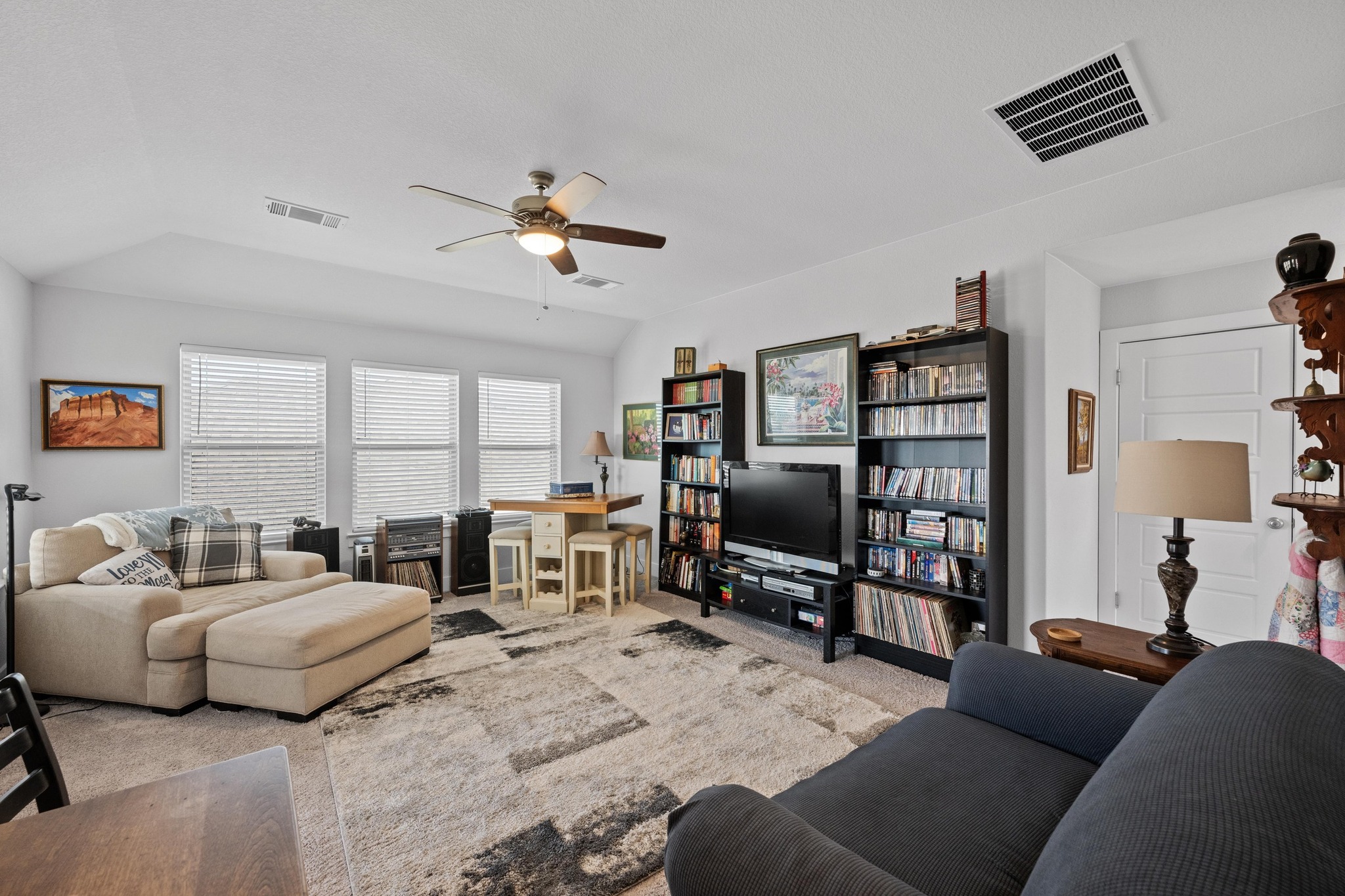 217 Palio Place Georgetown, TX 78628 - Photo 19 of 40 a living room with furniture a flat screen tv and a window
