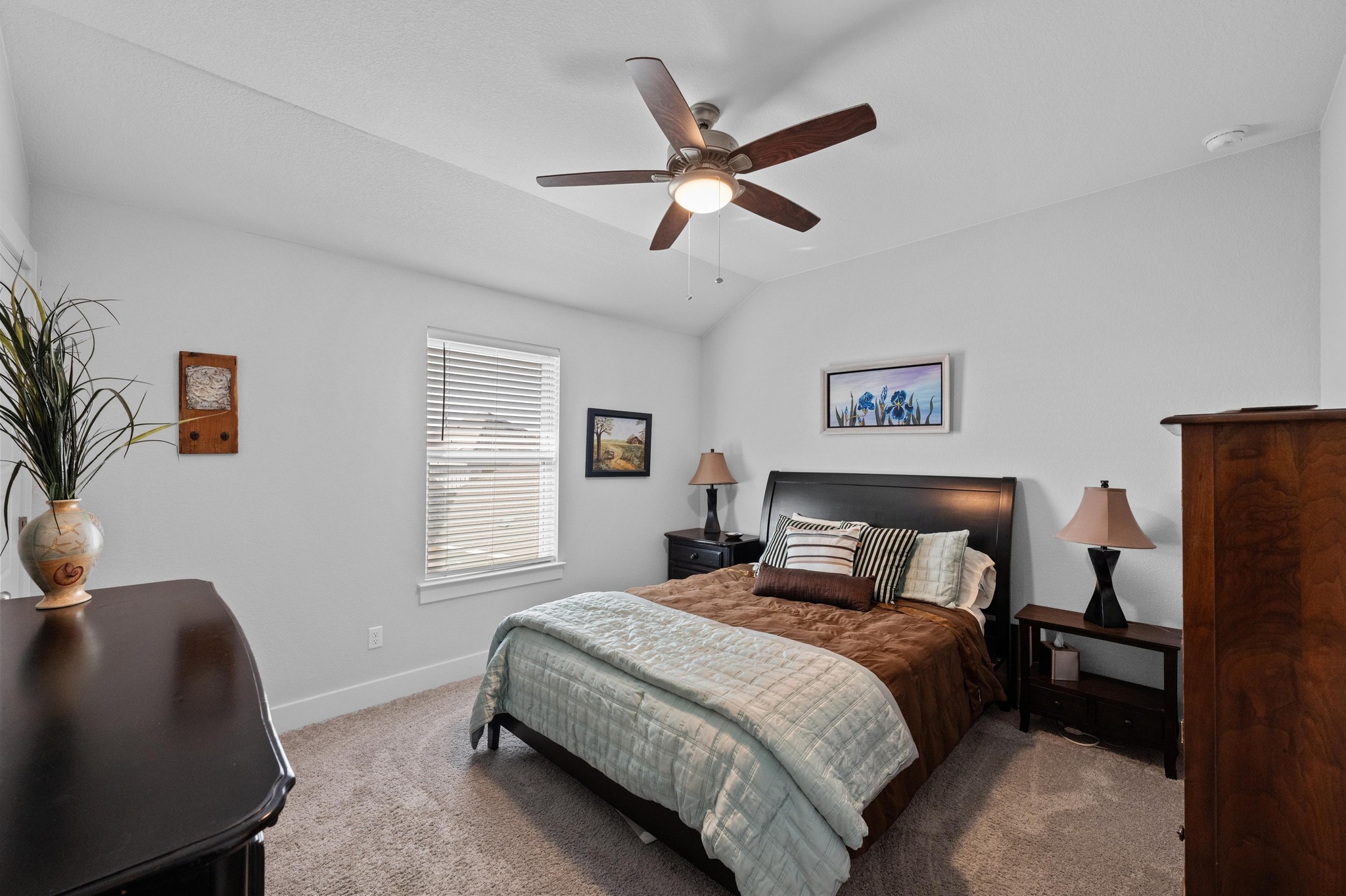 217 Palio Place Georgetown, TX 78628 - Photo 27 of 40 a bedroom with a bed a window and painting on the wall