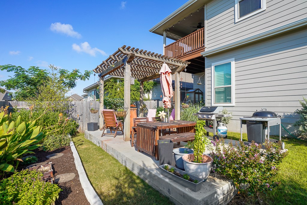 217 Palio Place Georgetown, TX 78628 - Photo 35 of 40 a view of a patio with table and chairs and potted plants