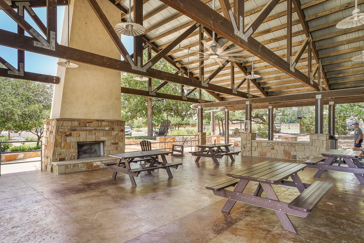217 Palio Place Georgetown, TX 78628 - Photo 38 of 40 a living room with fireplace furniture and a fireplace