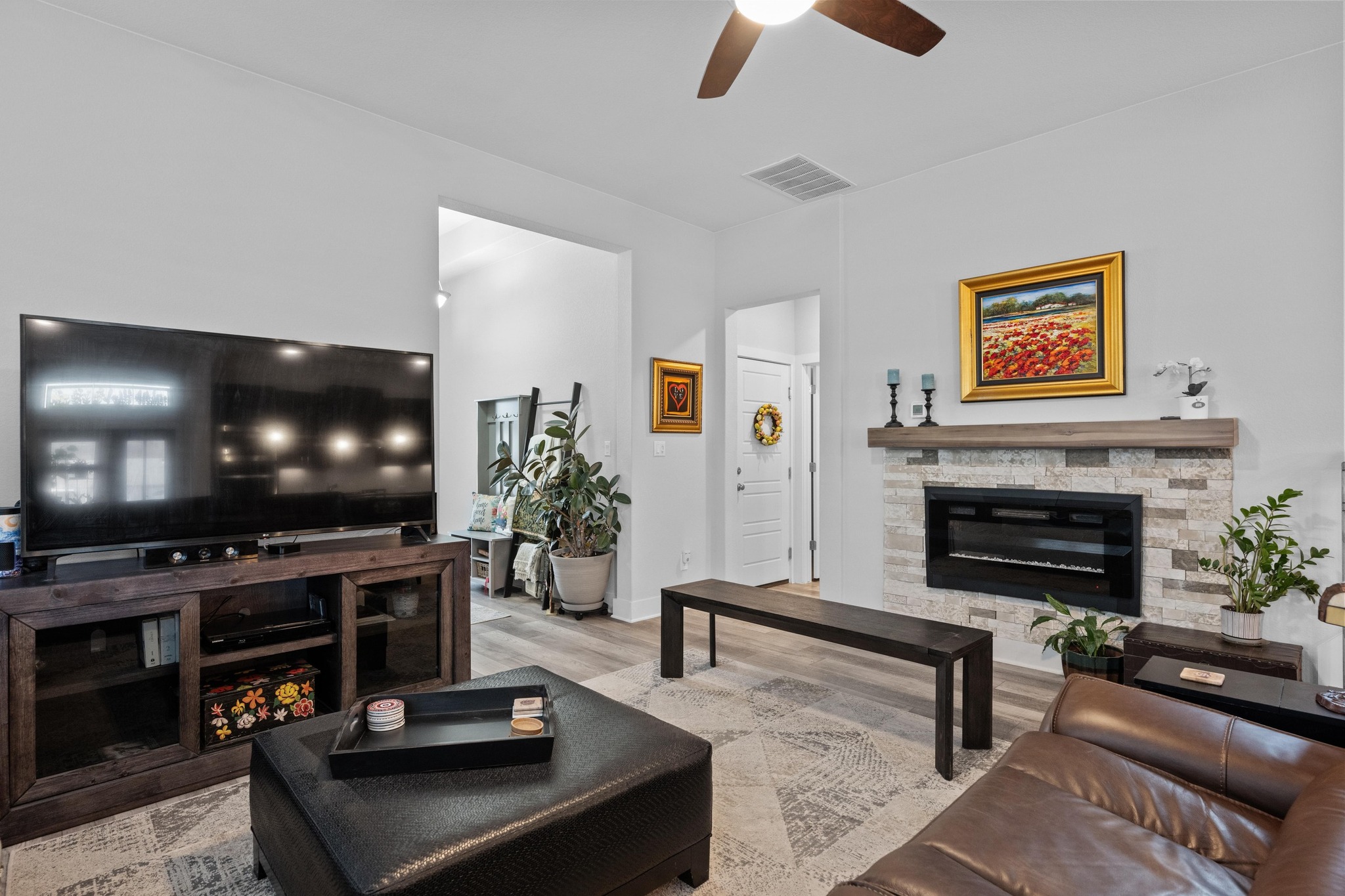 217 Palio Place Georgetown, TX 78628 - Photo 5 of 40 a living room with furniture and a flat screen tv