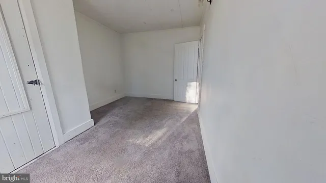 an entryway of a house with a hallway