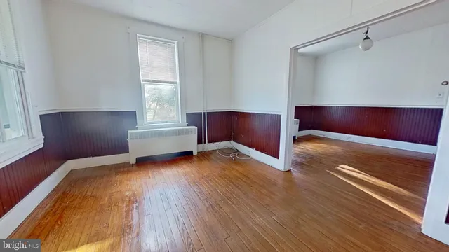 a bedroom with a bed and a chair