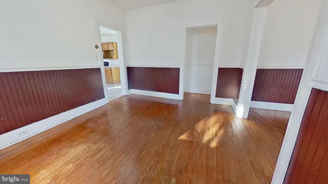 a view of a dining room with wooden floor