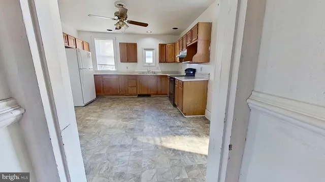 a view of a kitchen with a sink cabinet and a window