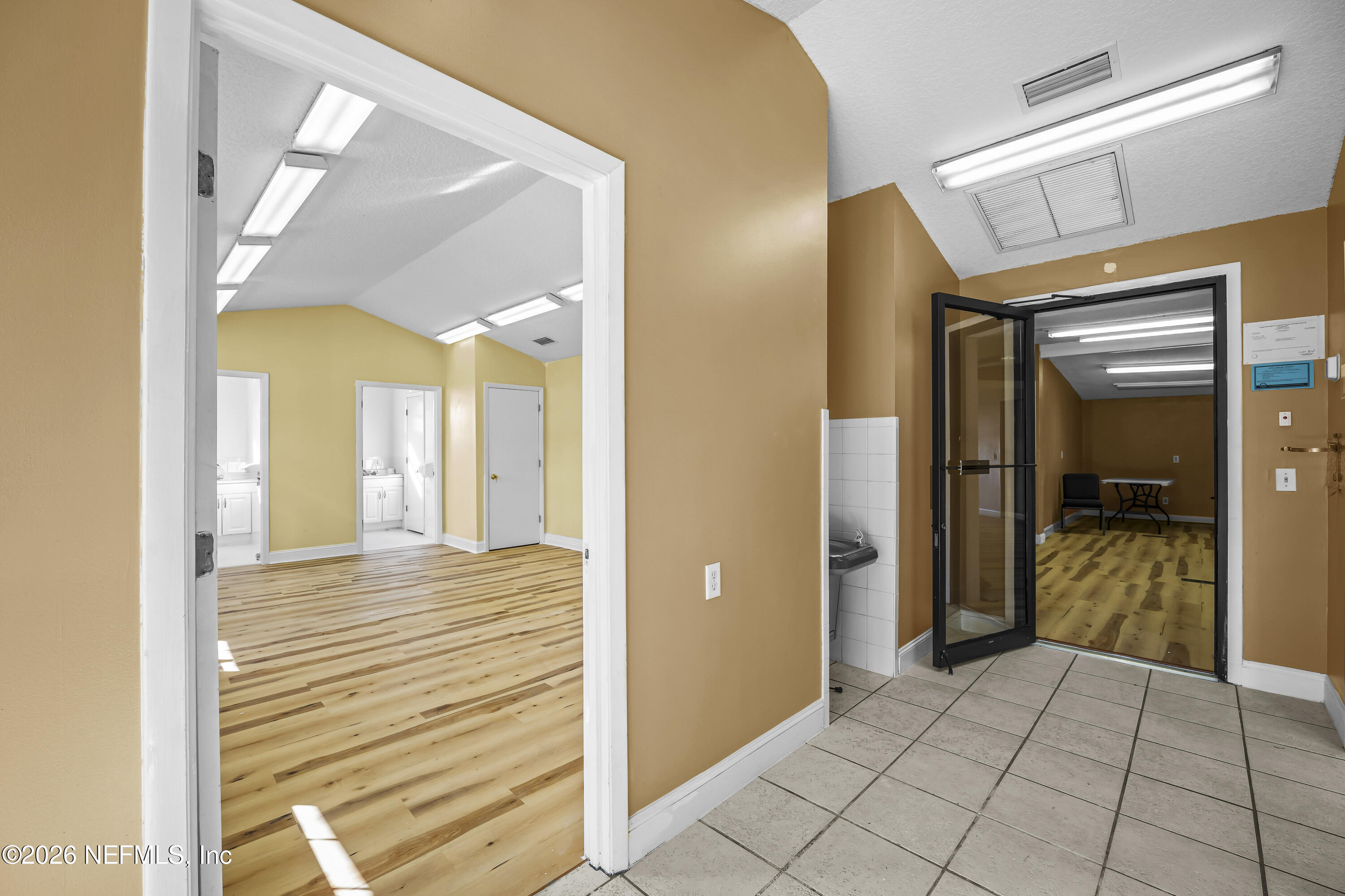 35 Cinnamon Street Middleburg, FL 32068 - Photo 16 of 56 a view of a hallway view with wooden floor and staircase