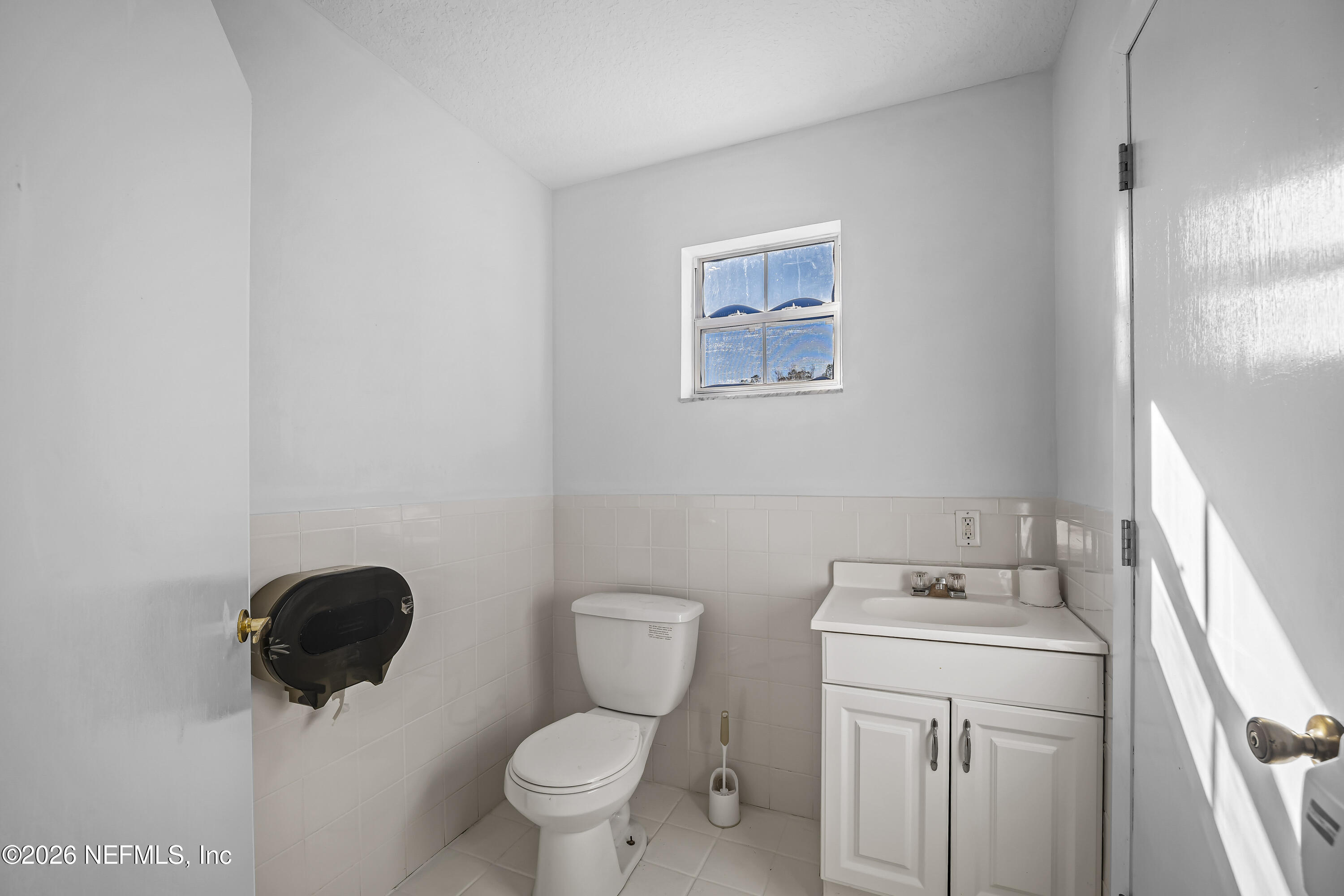 35 Cinnamon Street Middleburg, FL 32068 - Photo 21 of 56 a bathroom with a toilet sink and mirror