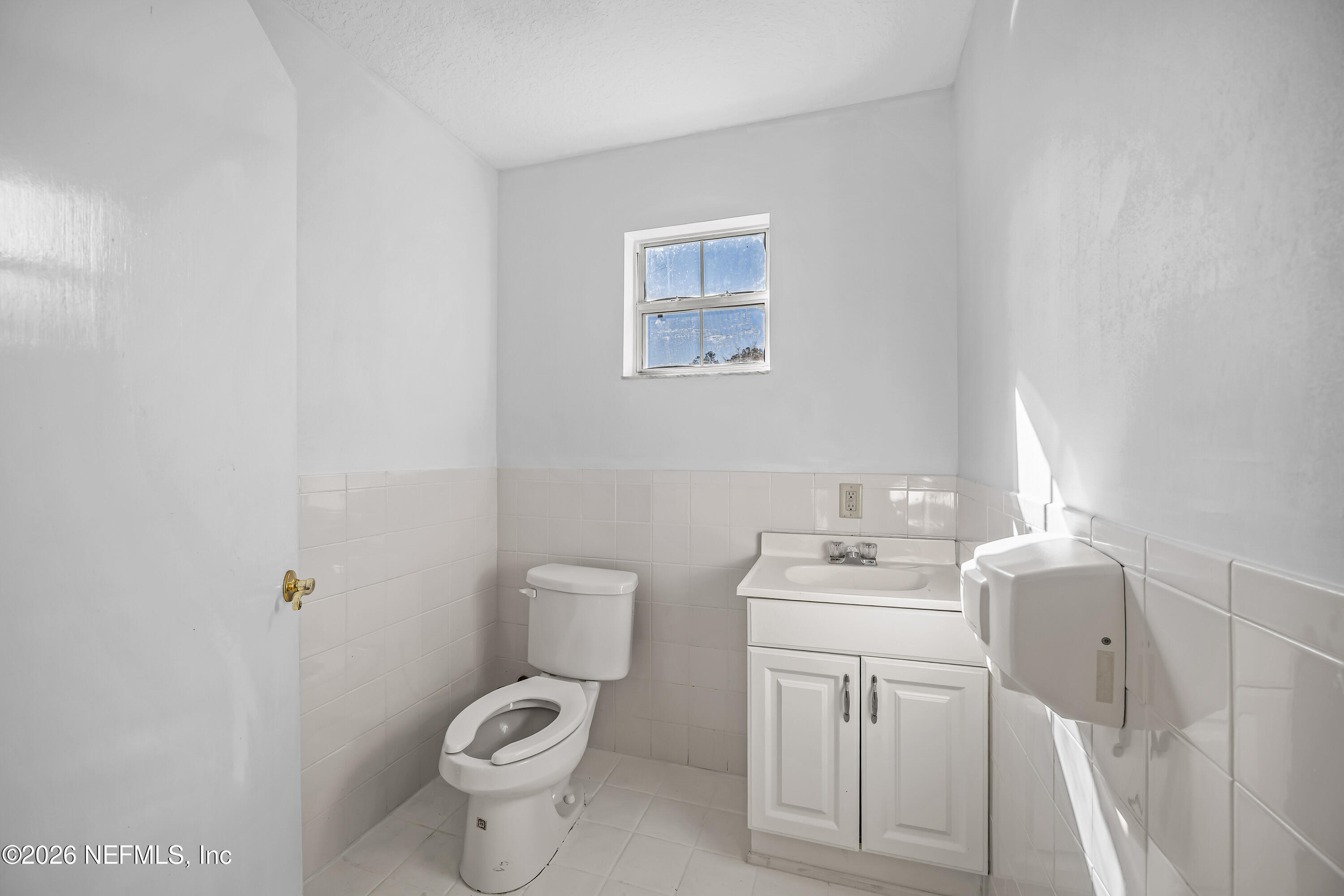 35 Cinnamon Street Middleburg, FL 32068 - Photo 22 of 56 a bathroom with a sink toilet and a mirror