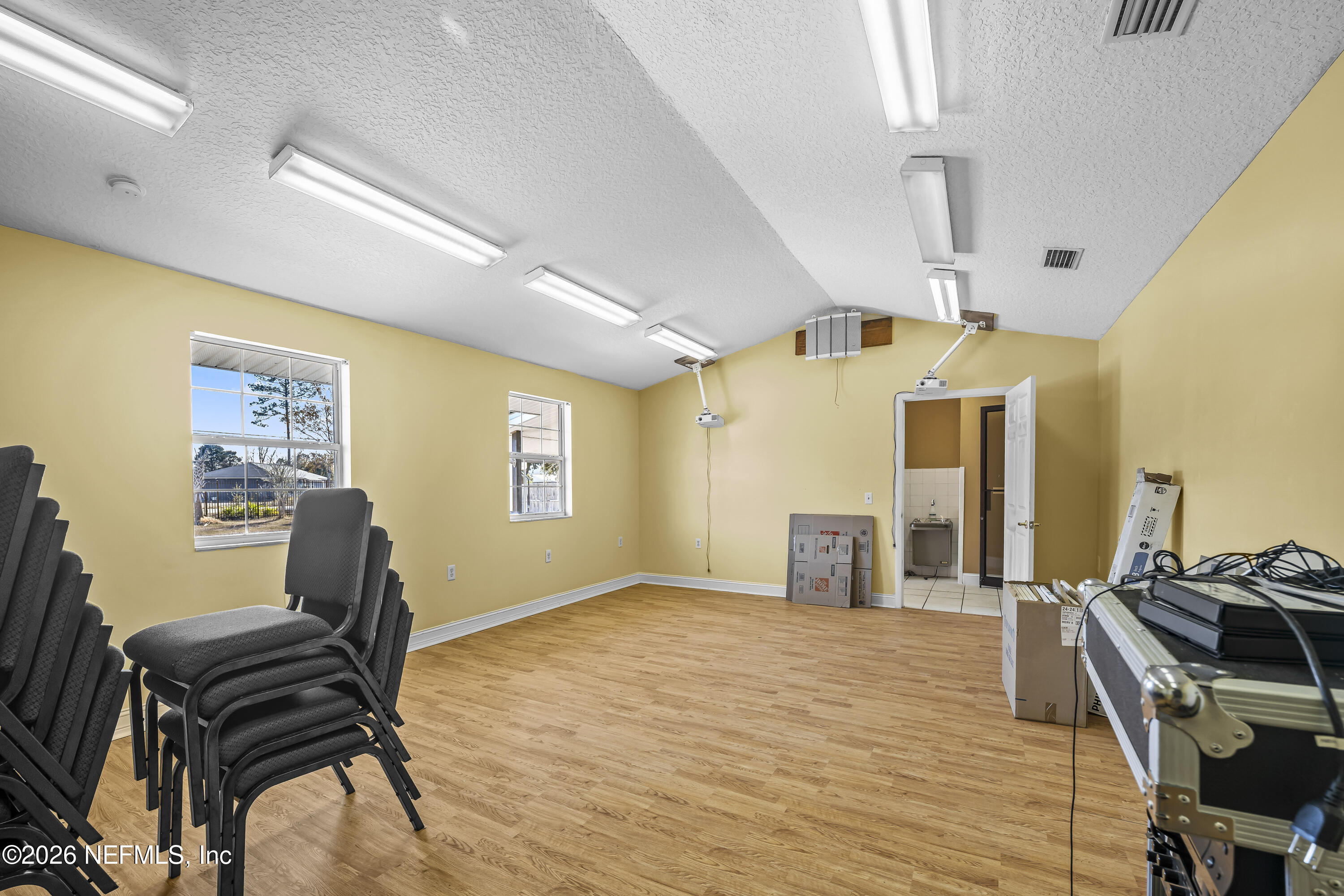 35 Cinnamon Street Middleburg, FL 32068 - Photo 24 of 56 a bedroom with furniture and wooden floor