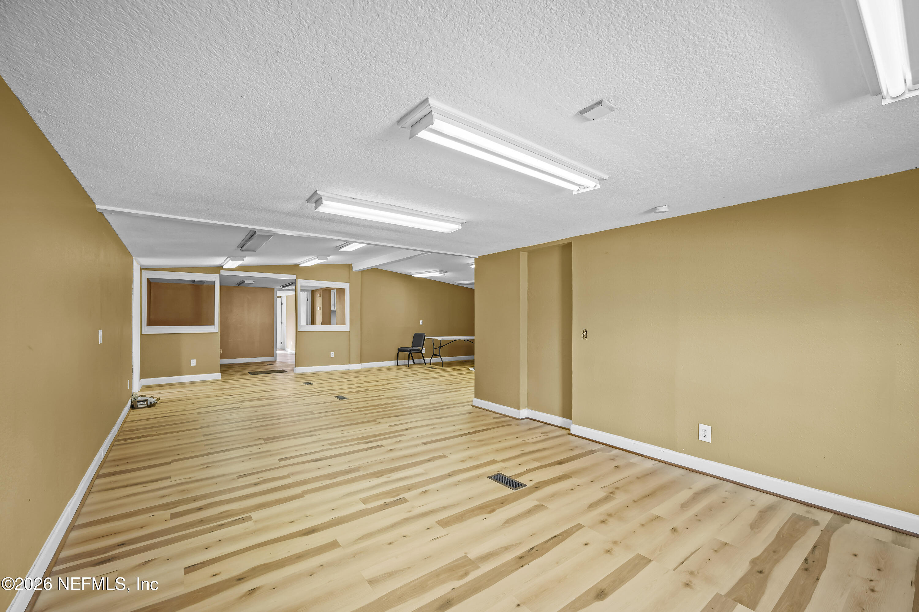 35 Cinnamon Street Middleburg, FL 32068 - Photo 27 of 56 a view of an empty room with wooden floor and a window