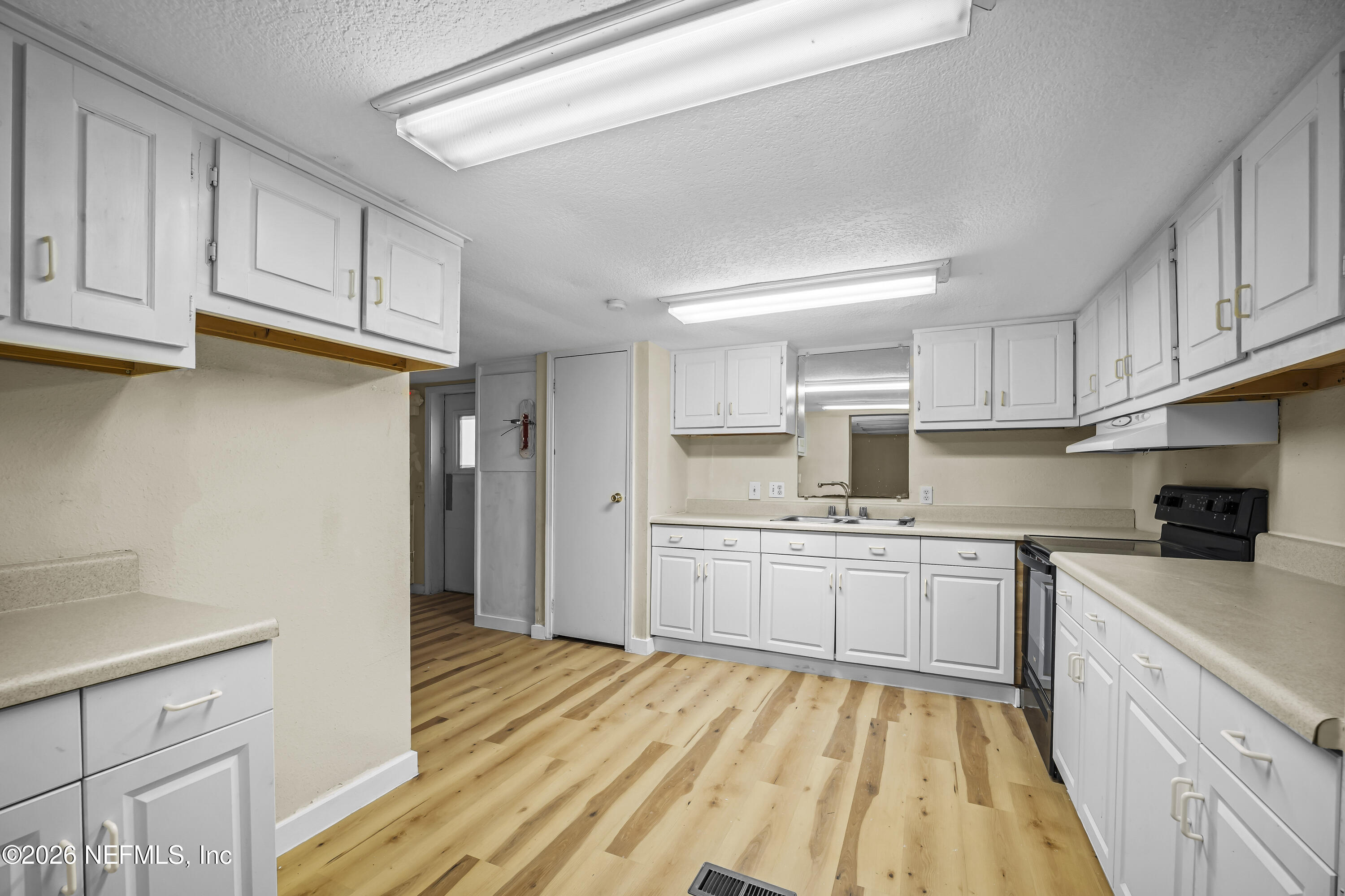 35 Cinnamon Street Middleburg, FL 32068 - Photo 32 of 56 a kitchen with stainless steel appliances granite countertop a refrigerator sink and cabinets