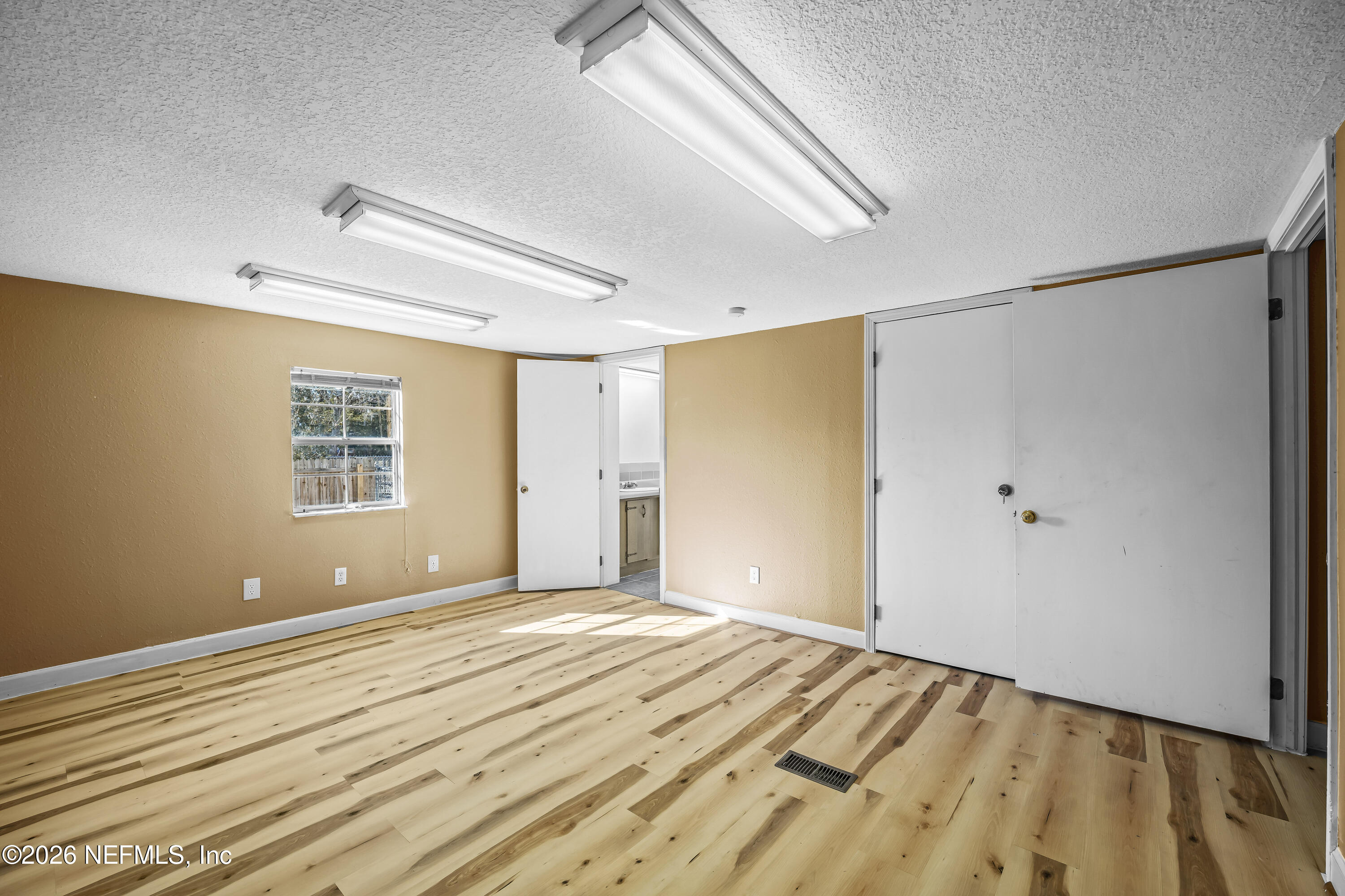 35 Cinnamon Street Middleburg, FL 32068 - Photo 35 of 56 a view of a big room with wooden floor and windows in a room