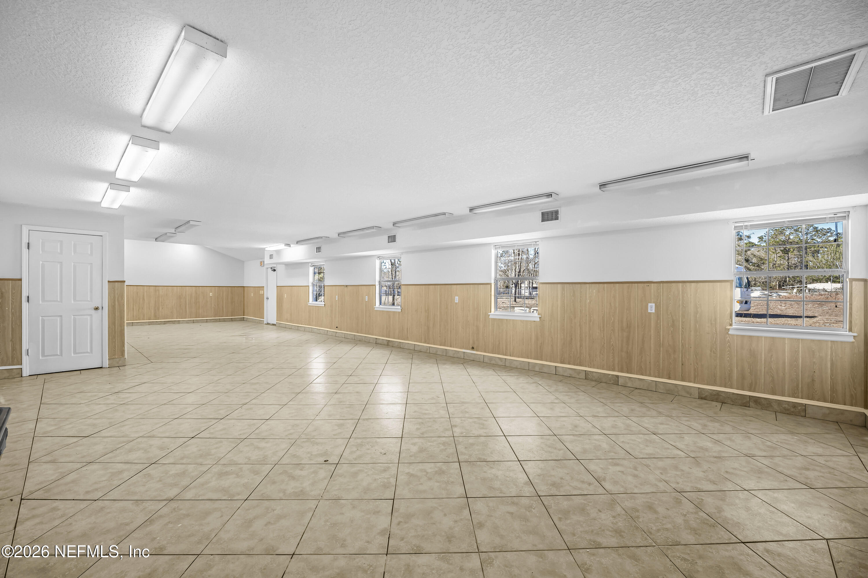 35 Cinnamon Street Middleburg, FL 32068 - Photo 40 of 56 a view of a kitchen with a dishwasher and cabinets