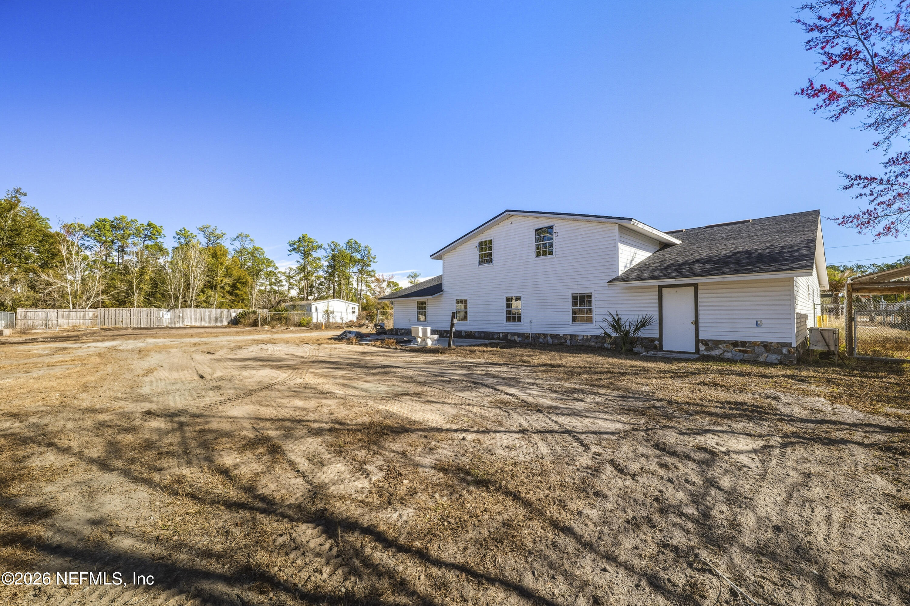35 Cinnamon Street Middleburg, FL 32068 - Photo 48 of 56 a view of a house with backyard and trees