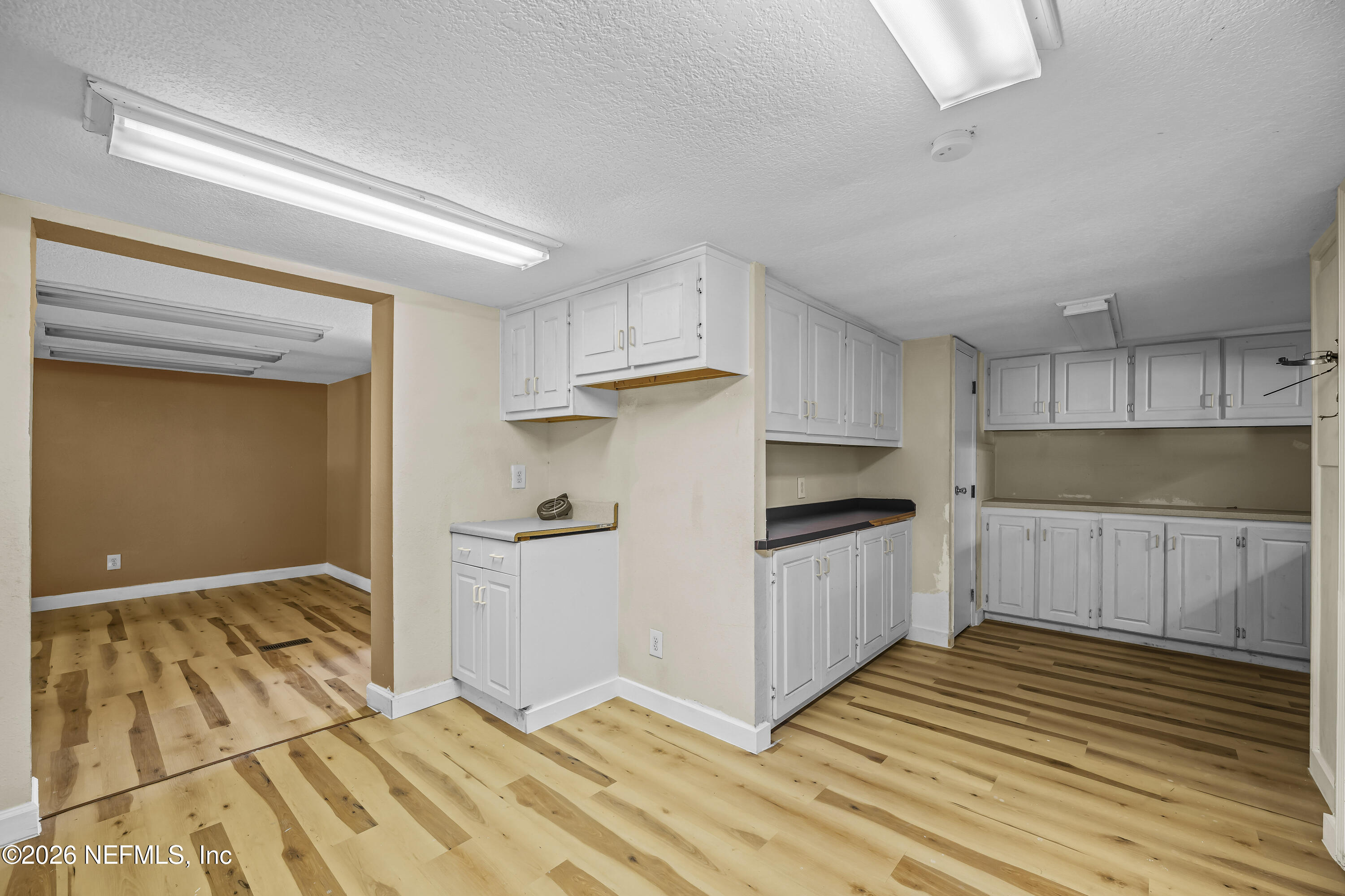 35 Cinnamon Street Middleburg, FL 32068 - Photo 5 of 56 a kitchen with granite countertop a sink stainless steel appliances and cabinets