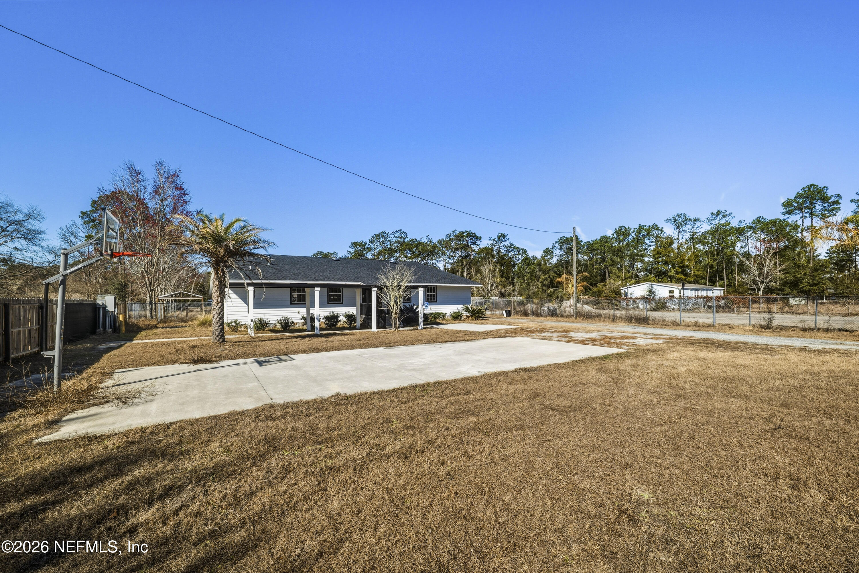35 Cinnamon Street Middleburg, FL 32068 - Photo 55 of 56 a front view of a house with a yard