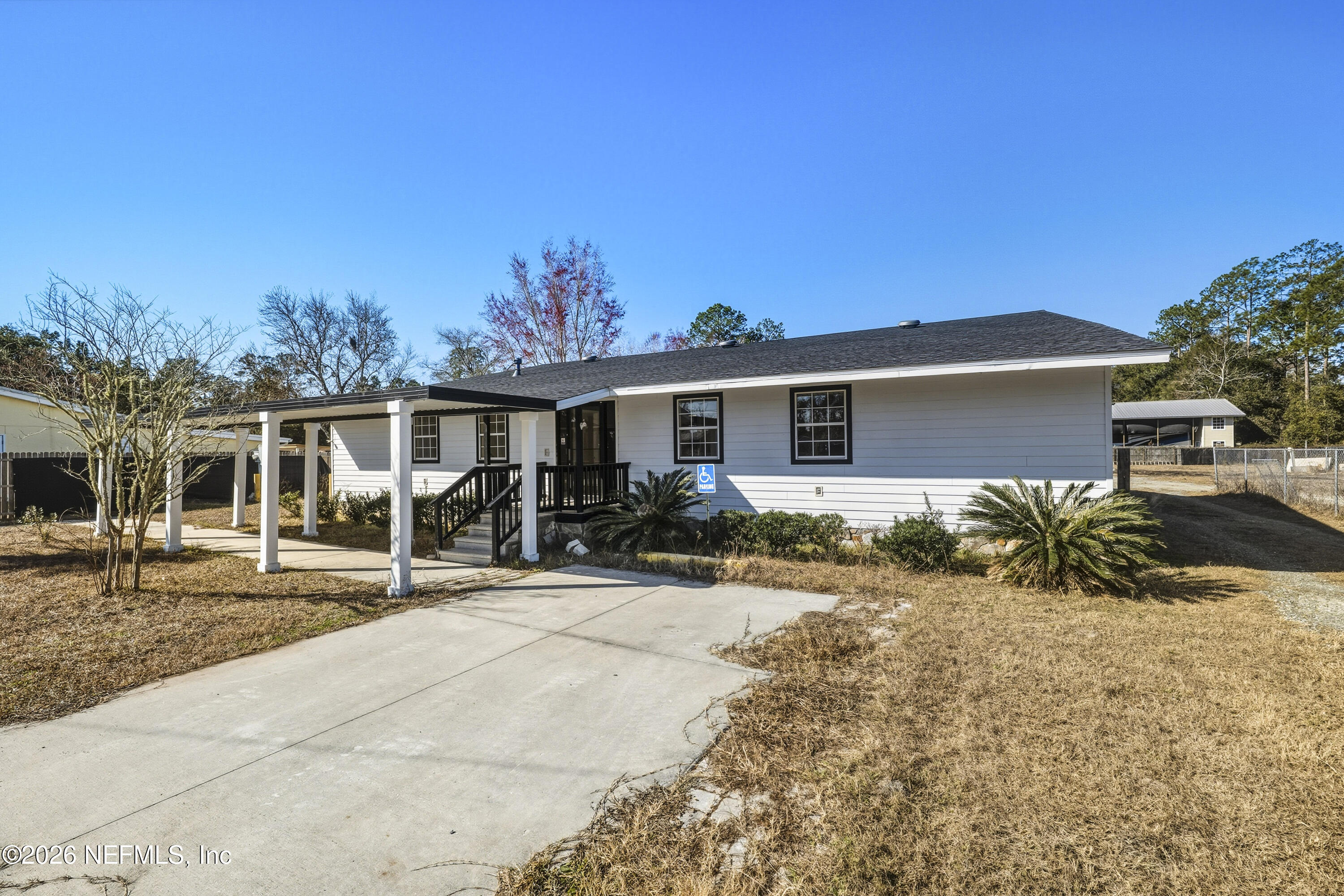 35 Cinnamon Street Middleburg, FL 32068 - Photo 56 of 56 a front view of a house with a patio