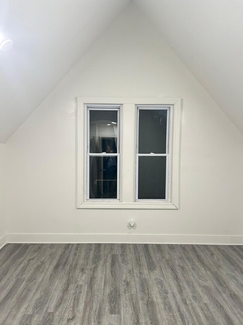 6843 South Carpenter Street Chicago, IL 60621 - Photo 10 of 11 an empty room with a window