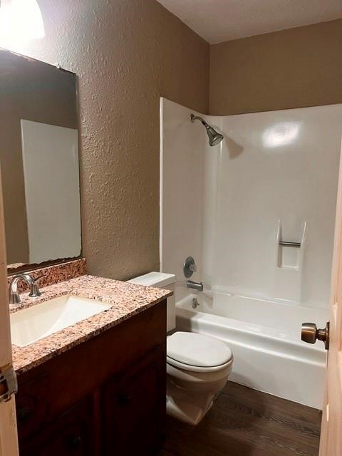 5017 Meandering Lane, Unit A Corpus Christi, TX 78413 - Photo 12 of 13 a bathroom with a granite countertop bathtub sink vanity mirror and toilet