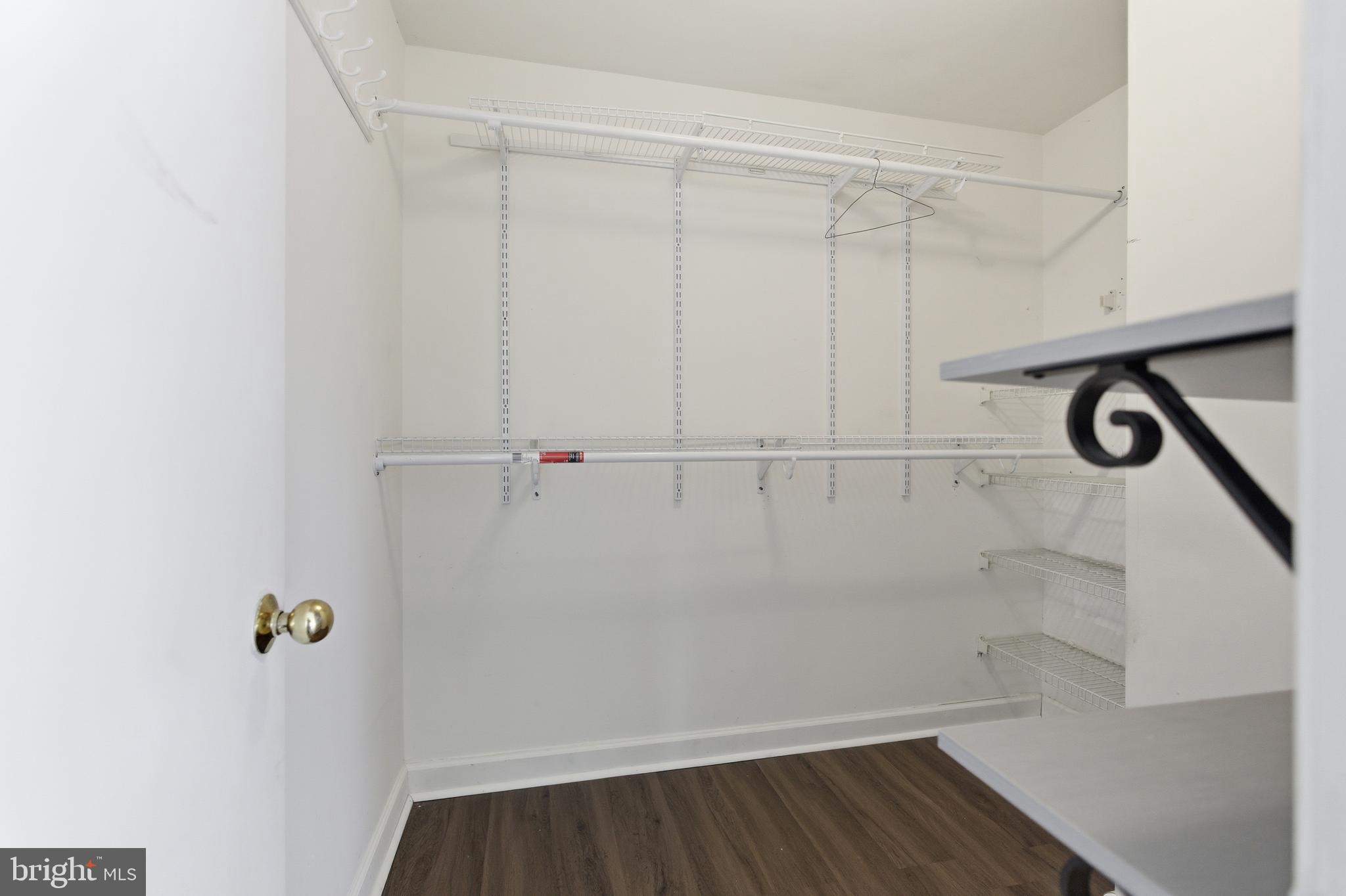 13609 Sir Thomas Way, Unit 1C24 Silver Spring, MD 20904 - Photo 5 of 16 a view of a room with racks on the wall