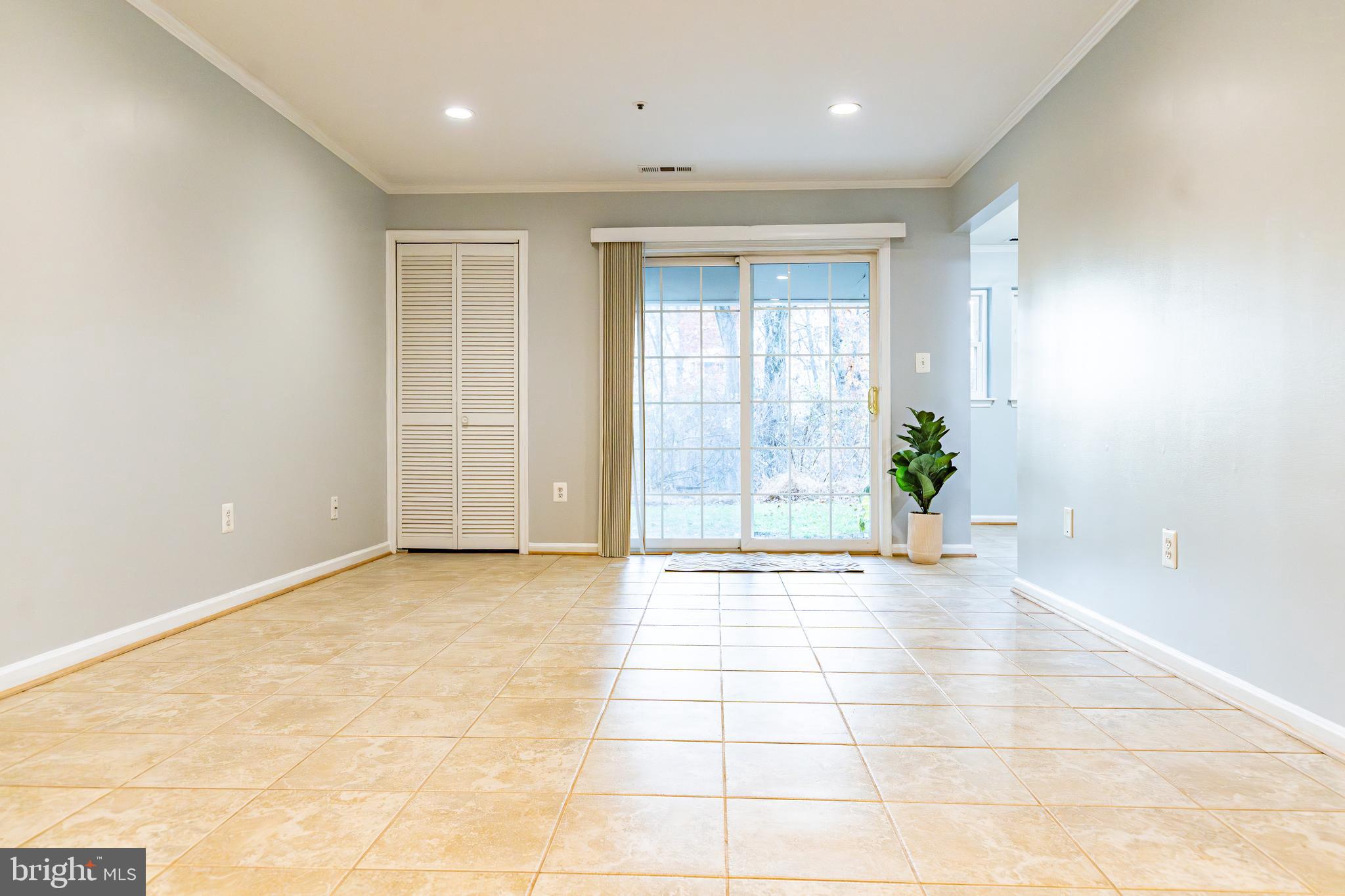 8347 Montgomery Run Road, Unit B Ellicott City, MD 21043 - Photo 12 of 39 a view of an empty room with potted plants