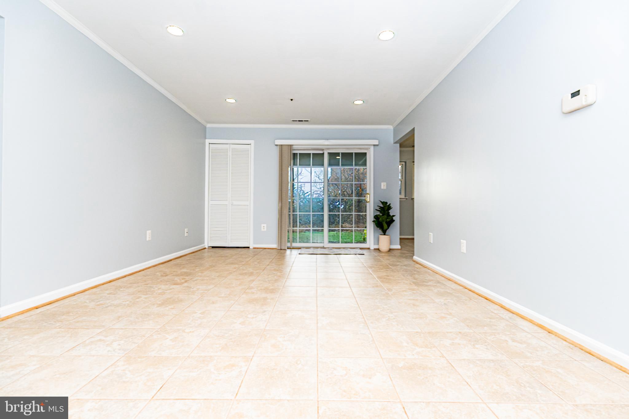 8347 Montgomery Run Road, Unit B Ellicott City, MD 21043 - Photo 13 of 39 an empty room with windows