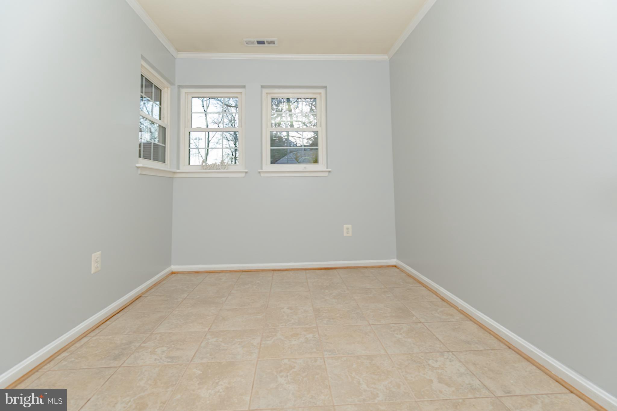8347 Montgomery Run Road, Unit B Ellicott City, MD 21043 - Photo 16 of 39 an empty room with windows