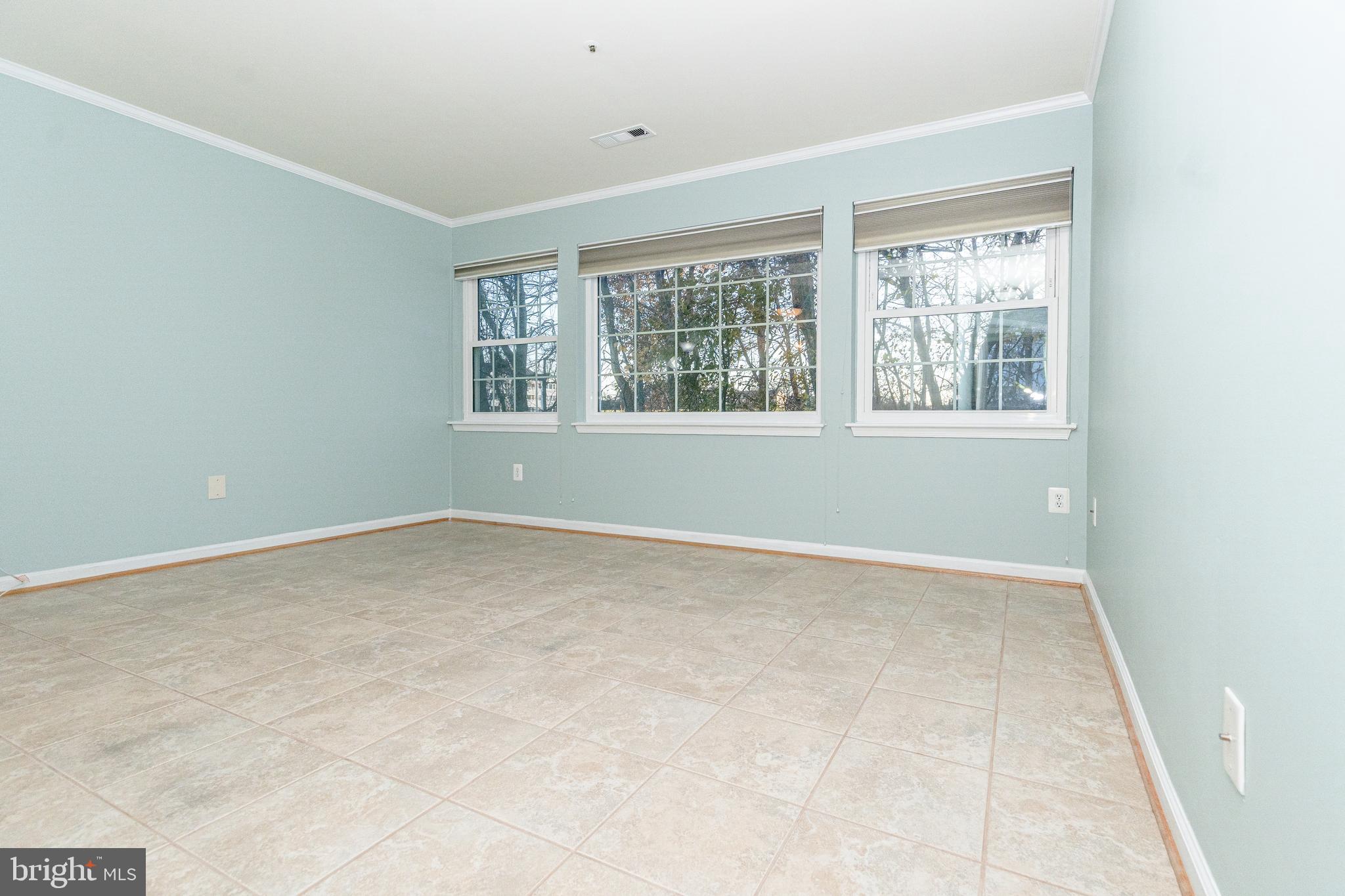 8347 Montgomery Run Road, Unit B Ellicott City, MD 21043 - Photo 18 of 39 an empty room with a window