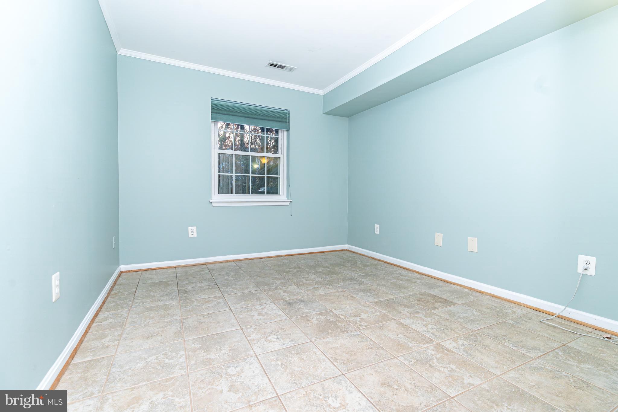 8347 Montgomery Run Road, Unit B Ellicott City, MD 21043 - Photo 24 of 39 an empty room with a window