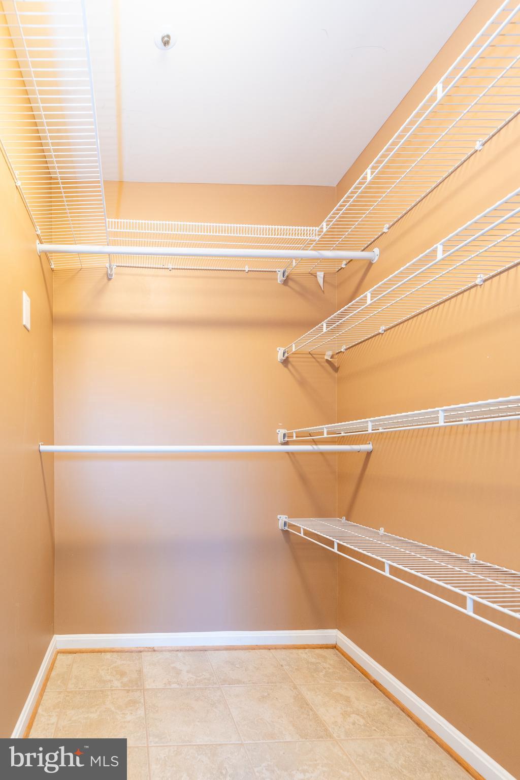 8347 Montgomery Run Road, Unit B Ellicott City, MD 21043 - Photo 28 of 39 a view of a room with racks on the wall