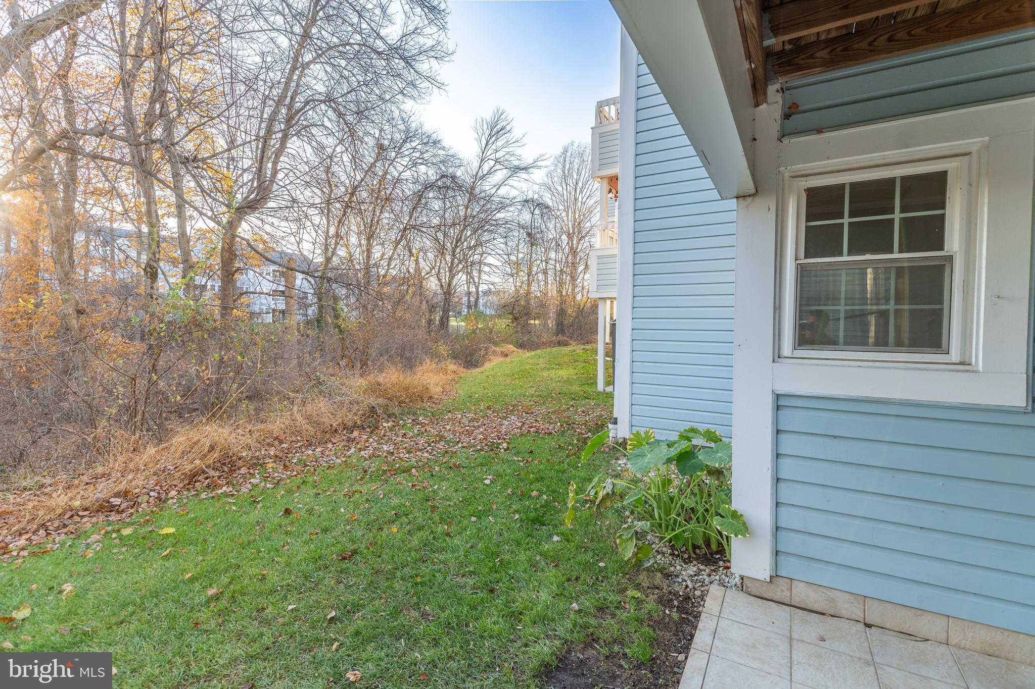 8347 Montgomery Run Road, Unit B Ellicott City, MD 21043 - Photo 33 of 39 a backyard of a house with lots of green space