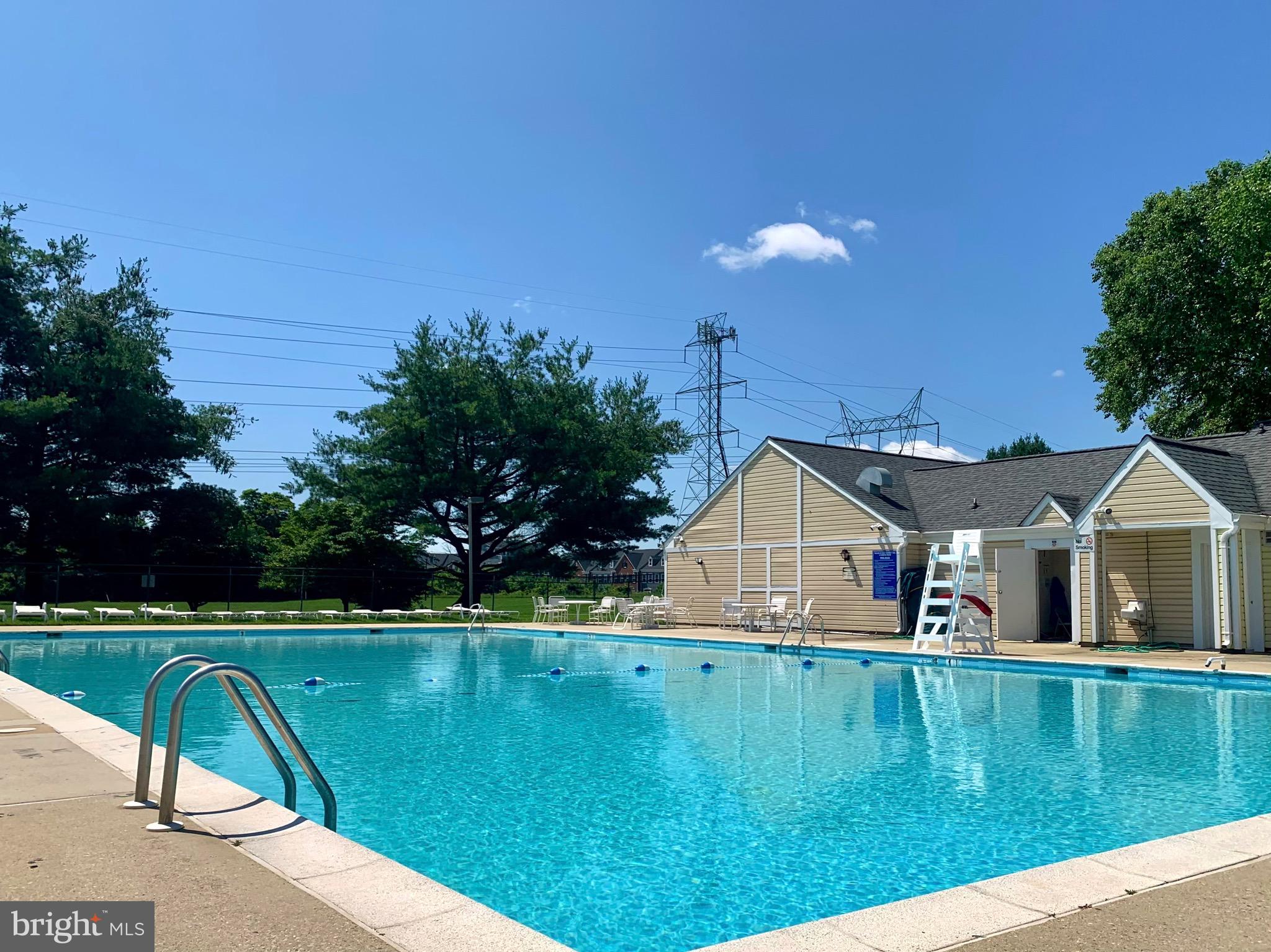 8347 Montgomery Run Road, Unit B Ellicott City, MD 21043 - Photo 36 of 39 a view of a house with a yard and table