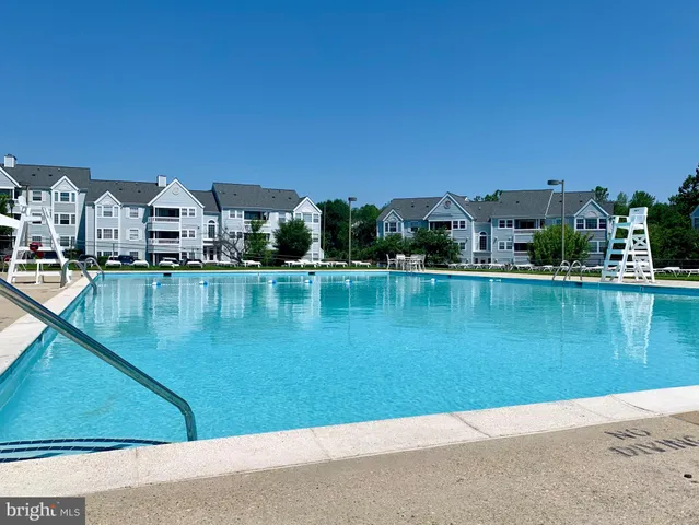 a view of a lake with a houses in the background
