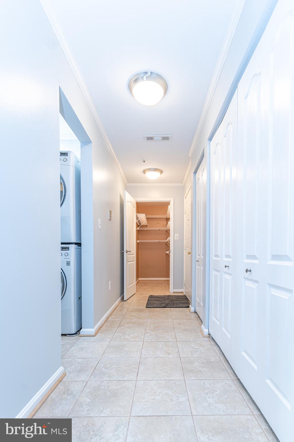 8347 Montgomery Run Road, Unit B Ellicott City, MD 21043 - Photo 7 of 39 a view of a hallway with wooden shelves