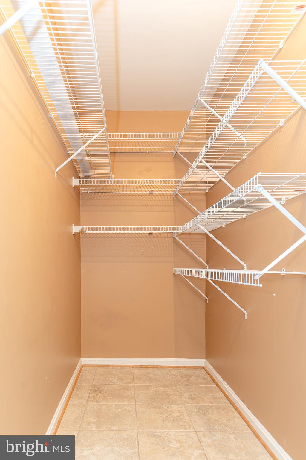 8347 Montgomery Run Road, Unit B Ellicott City, MD 21043 - Photo 8 of 39 a view of a room with racks on the wall