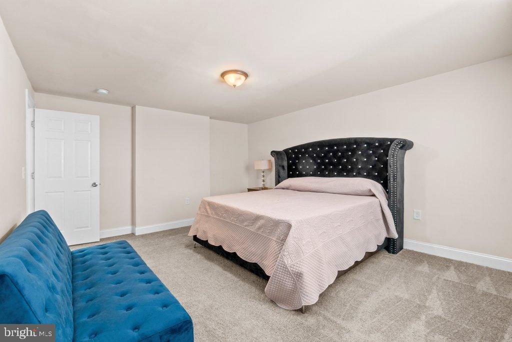 4919 Harford Road Baltimore, MD 21214 - Photo 31 of 48 a bedroom with a bed and a couch