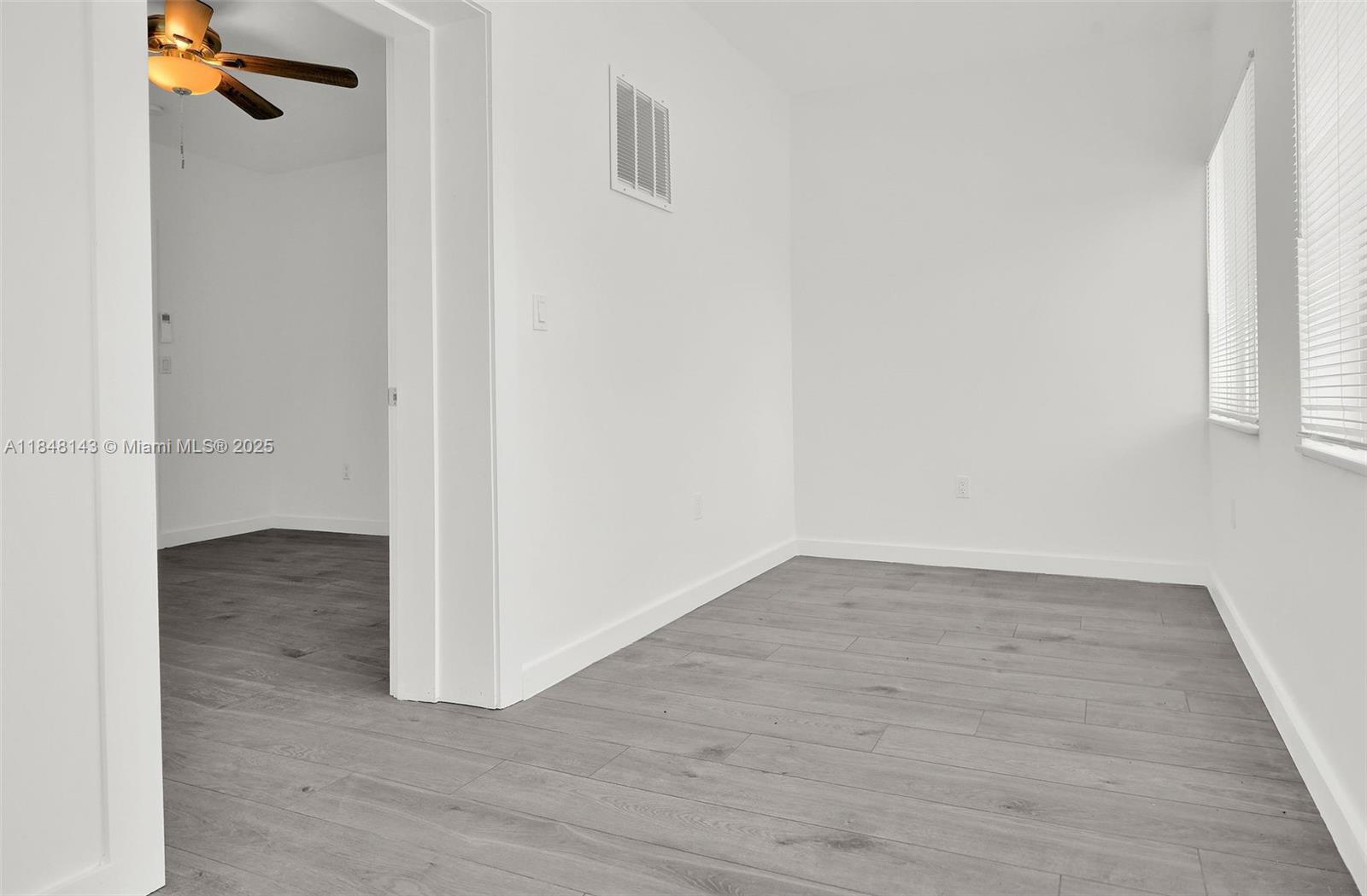 600 Northwest 25th Court Miami, FL 33125 - Photo 11 of 16 a view of a room with wooden floor