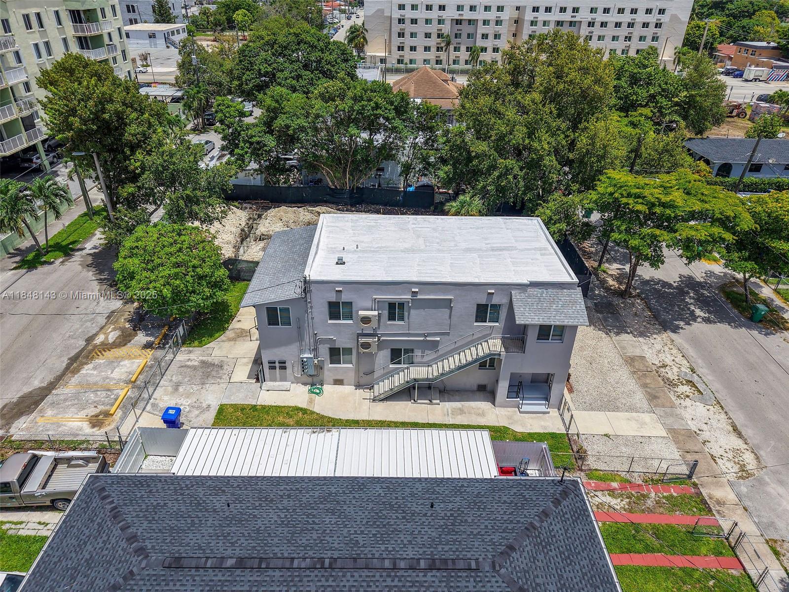 600 Northwest 25th Court Miami, FL 33125 - Photo 15 of 16 an aerial view of a house with swimming pool