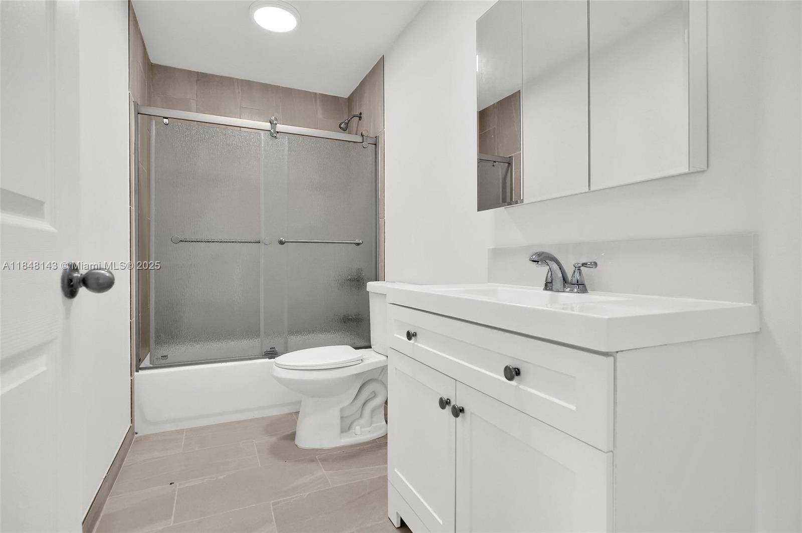 600 Northwest 25th Court Miami, FL 33125 - Photo 7 of 16 a bathroom with a sink toilet and shower