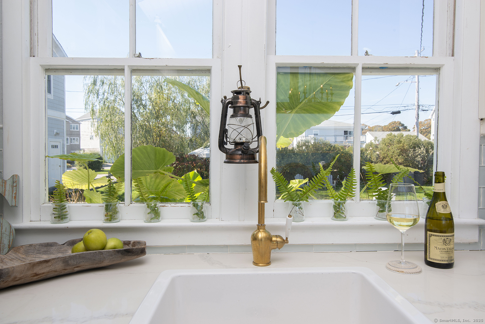 114 Jupiter Point Road Groton, CT 06340 - Photo 13 of 34 a kitchen with a sink and breakfast area