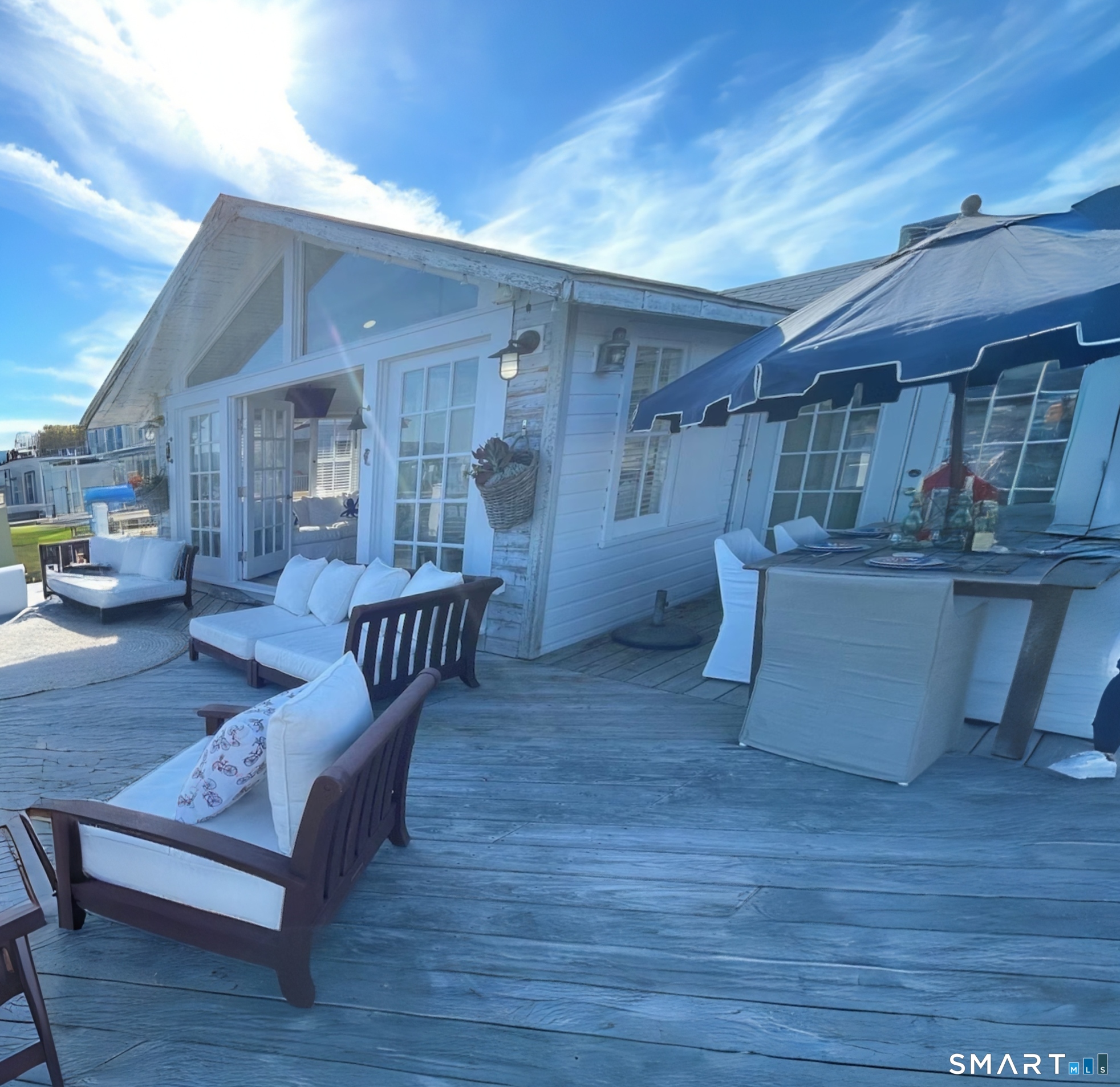 114 Jupiter Point Road Groton, CT 06340 - Photo 23 of 34 a living room with furniture and a wooden floor