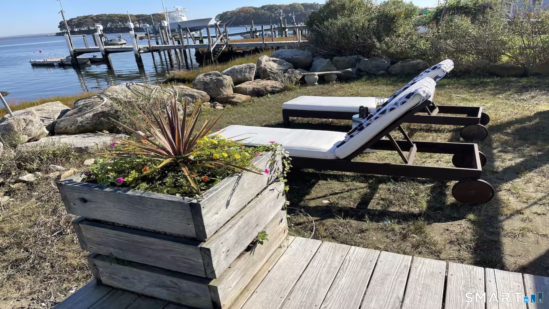 114 Jupiter Point Road Groton, CT 06340 - Photo 26 of 34 a roof deck with couch and wooden floor