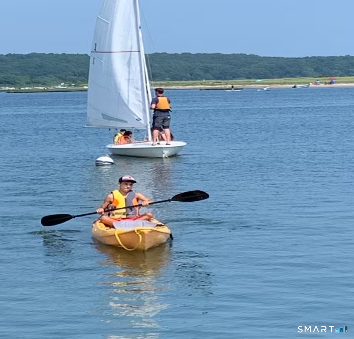 114 Jupiter Point Road Groton, CT 06340 - Photo 28 of 34 a view of a lake with a table and a chair