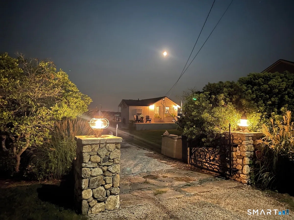 114 Jupiter Point Road Groton, CT 06340 - Photo 31 of 34 a view of a chairs and table in backyard