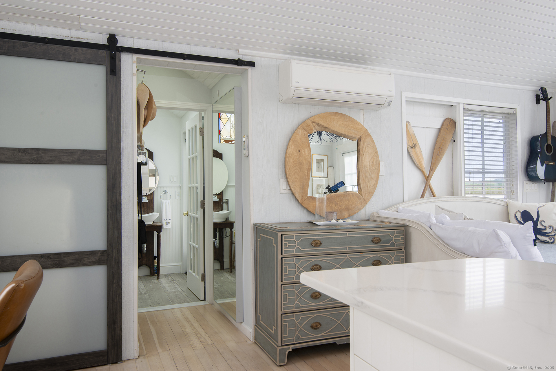 114 Jupiter Point Road Groton, CT 06340 - Photo 7 of 34 a bathroom with a sink a mirror and a bathtub