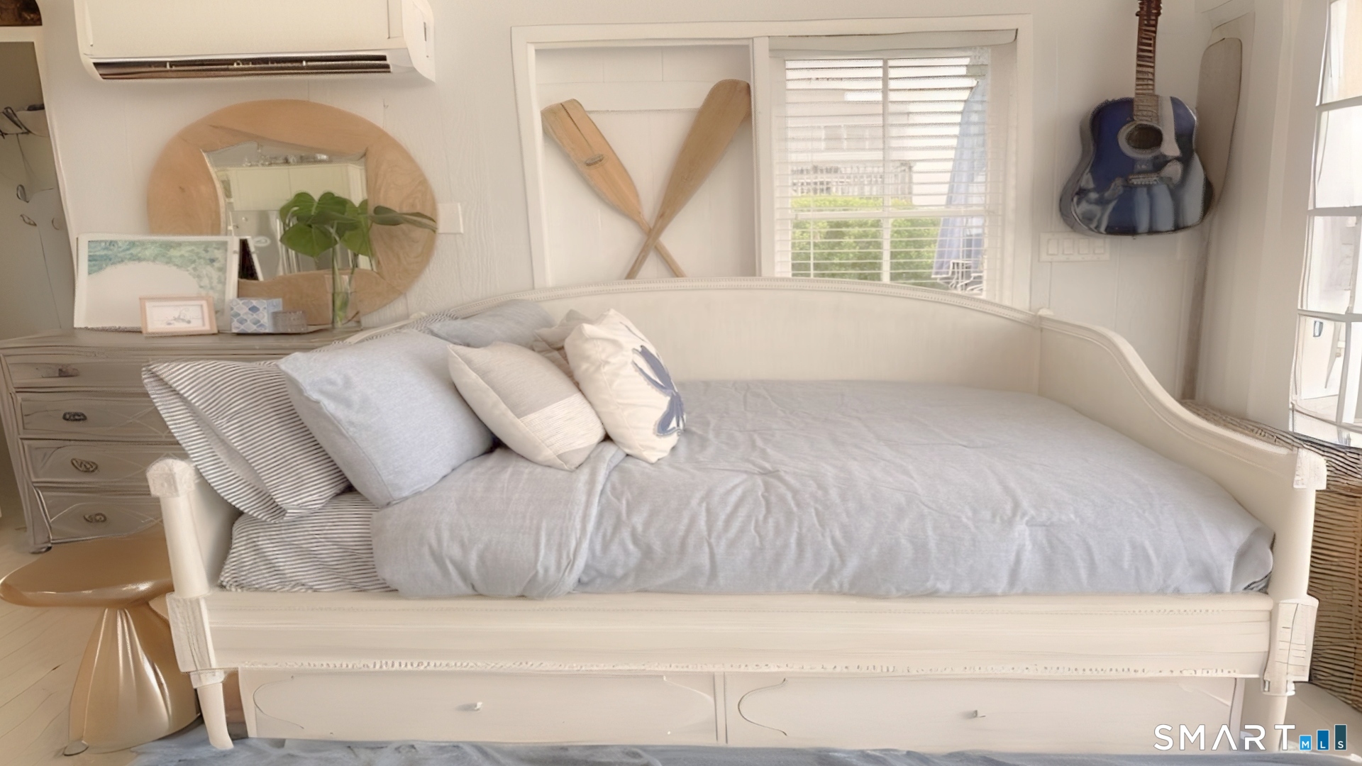 114 Jupiter Point Road Groton, CT 06340 - Photo 9 of 34 a bedroom with a bed a mirror and a window