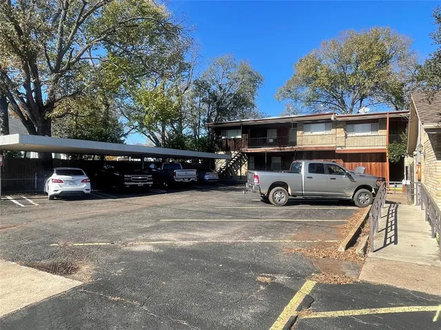 a car parked in the parking lot of a house