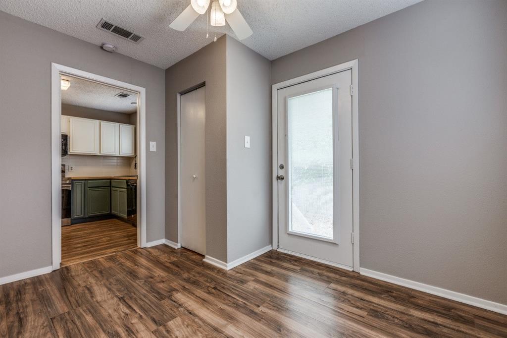312 Mockingbird Lane Denton, TX 76209 - Photo 13 of 25 Living room with wood flooring and ceiling fan.