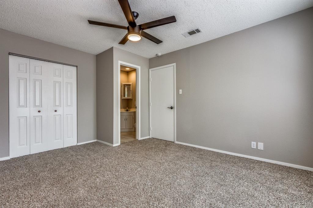 312 Mockingbird Lane Denton, TX 76209 - Photo 18 of 25 Bedroom with carpet, ceiling fan and large windows allowing for plenty of natural light.