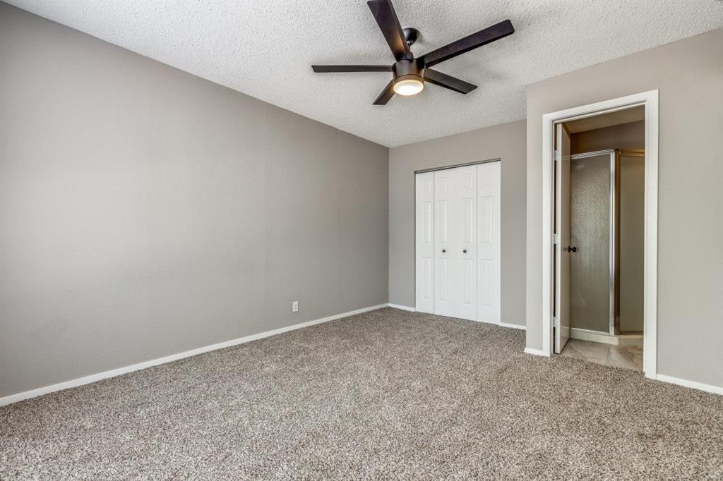 312 Mockingbird Lane Denton, TX 76209 - Photo 19 of 25 Bedroom with carpet, ceiling fan and large windows allowing for plenty of natural light.